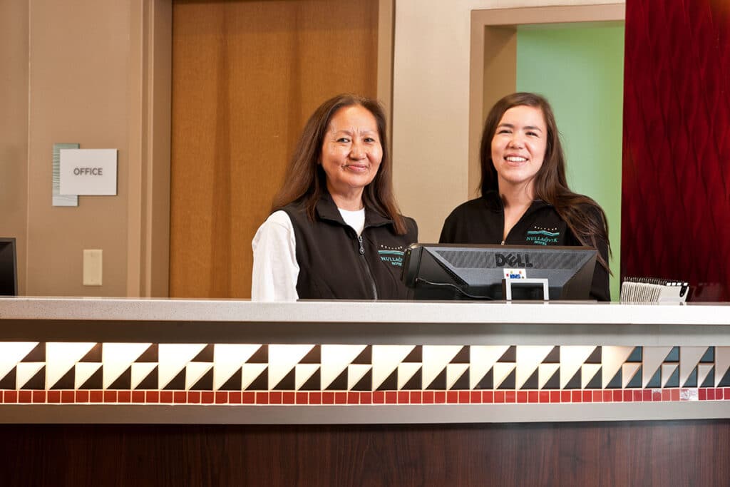 Two women at the front desk