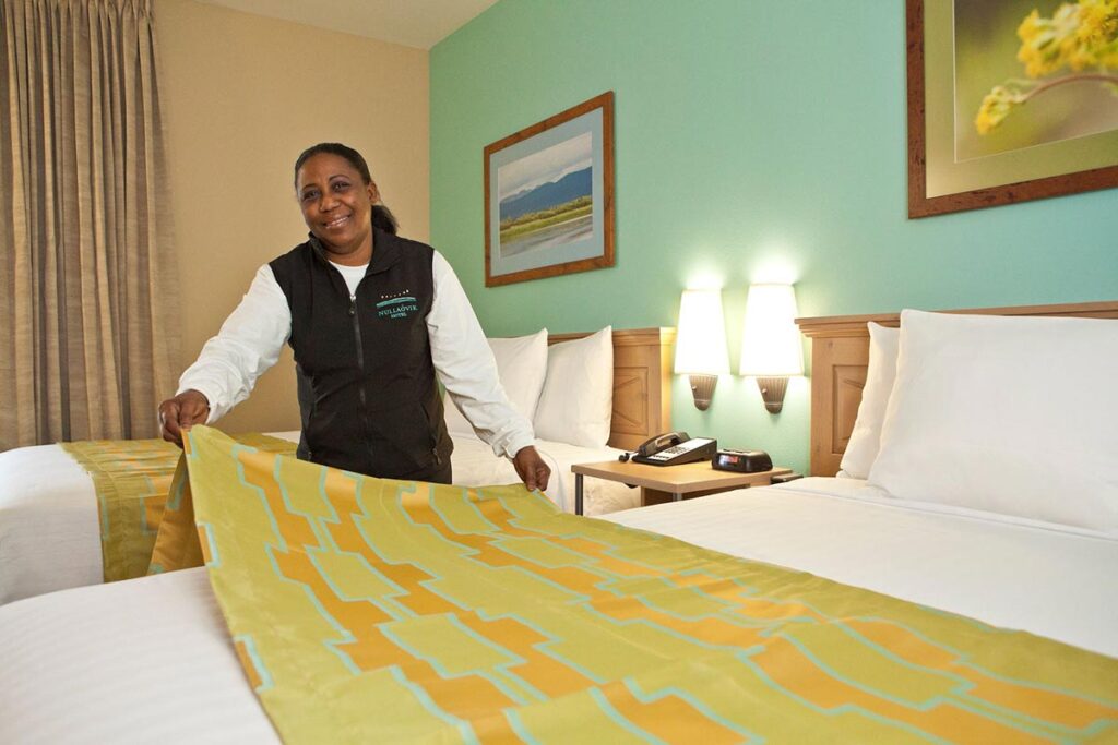Woman making the hotel bed